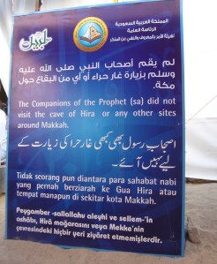 The sign reads: "The Companions of the Prophet (sa) did not visit the cave of Hira or any other sites around Makkah."