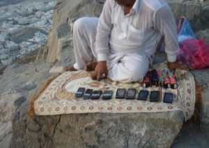 A vendor on the mountain sells mobile phones
